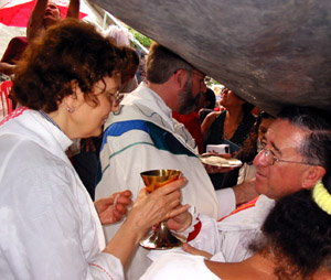 Kay reciving communion from Bishop Martín